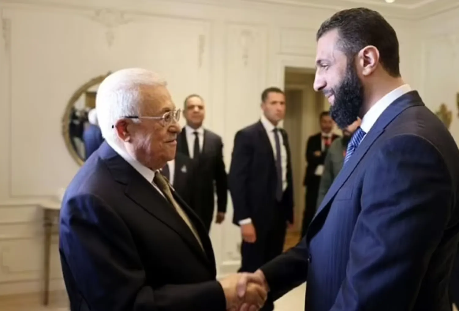 Syria's interim President Ahmed al-Sharaa meets Palestinian counterpart Mahmoud Abbas on the sidelines of his first Arab summit. - AFP

