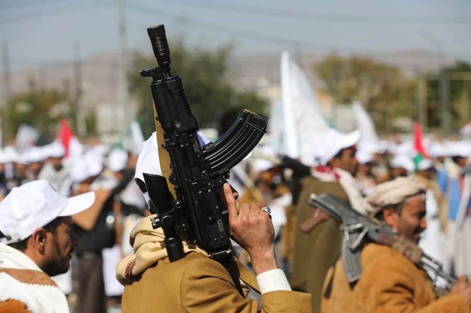 Newly recruited fighters who joined a Houthi force intended to be sent to fight in support of the Palestinians in the Gaza Strip, march during a parade in Sanaa, Yemen December 2, 2023. (Reuters)