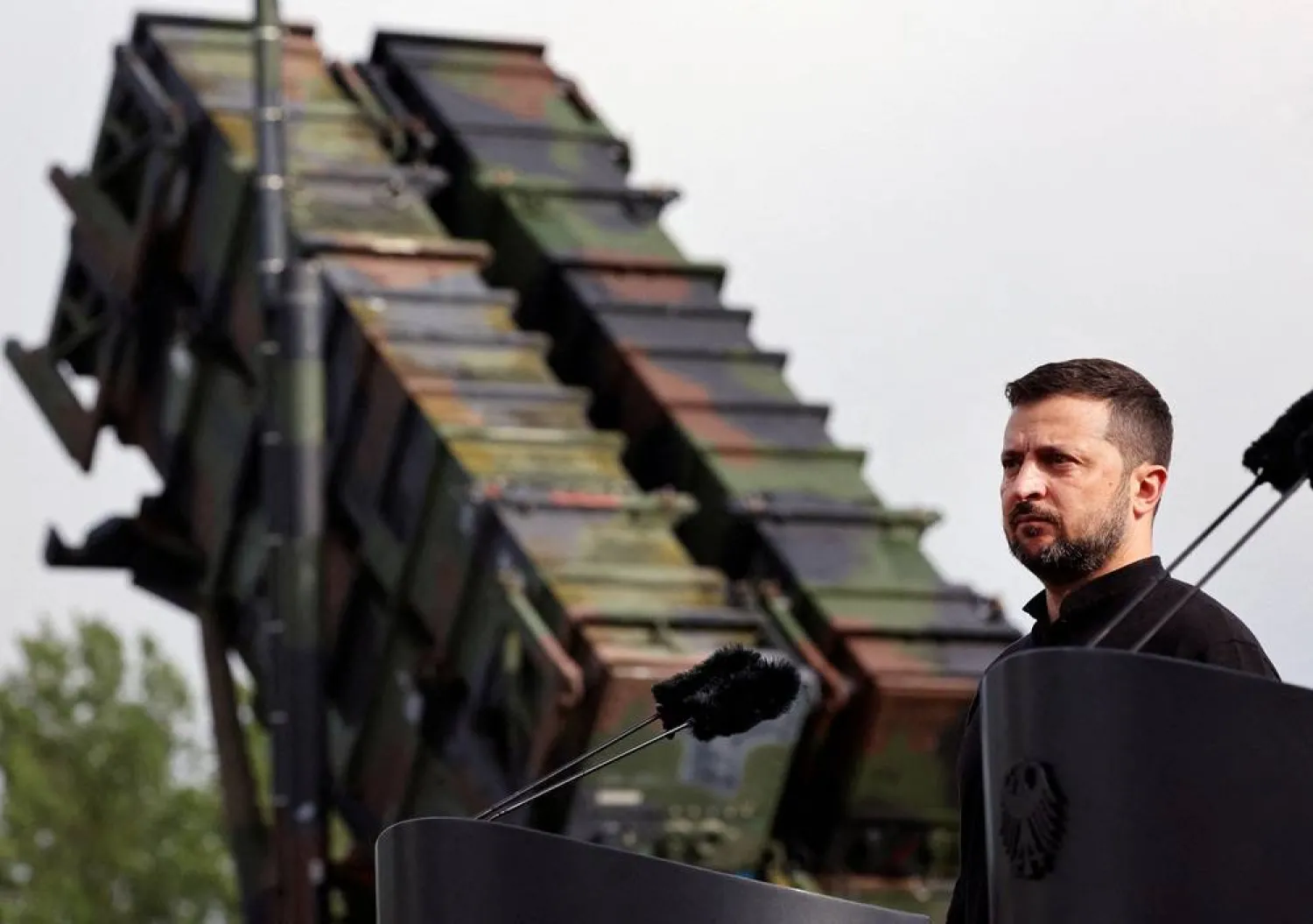 Ukrainian President Volodymyr Zelenskiy looks on during a visit to a military training area to find out about the training of Ukrainian soldiers on the Patriot anti-aircraft missile system, at an undisclosed location, in Germany, June 11, 2024. (Reuters)