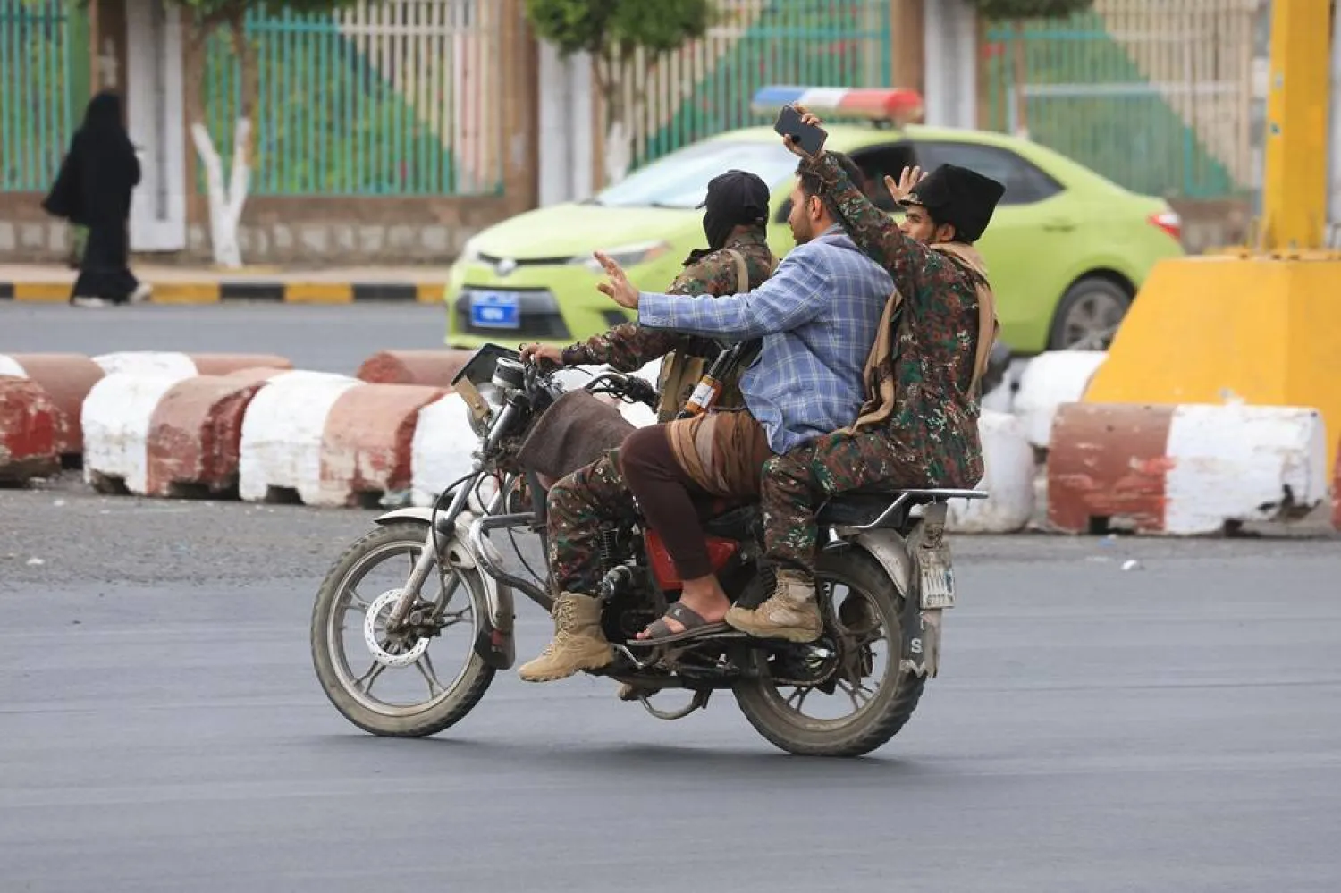 Houthi members ride a motorcycle along a street in Sanaa, Yemen, 04 March 2025. (EPA)