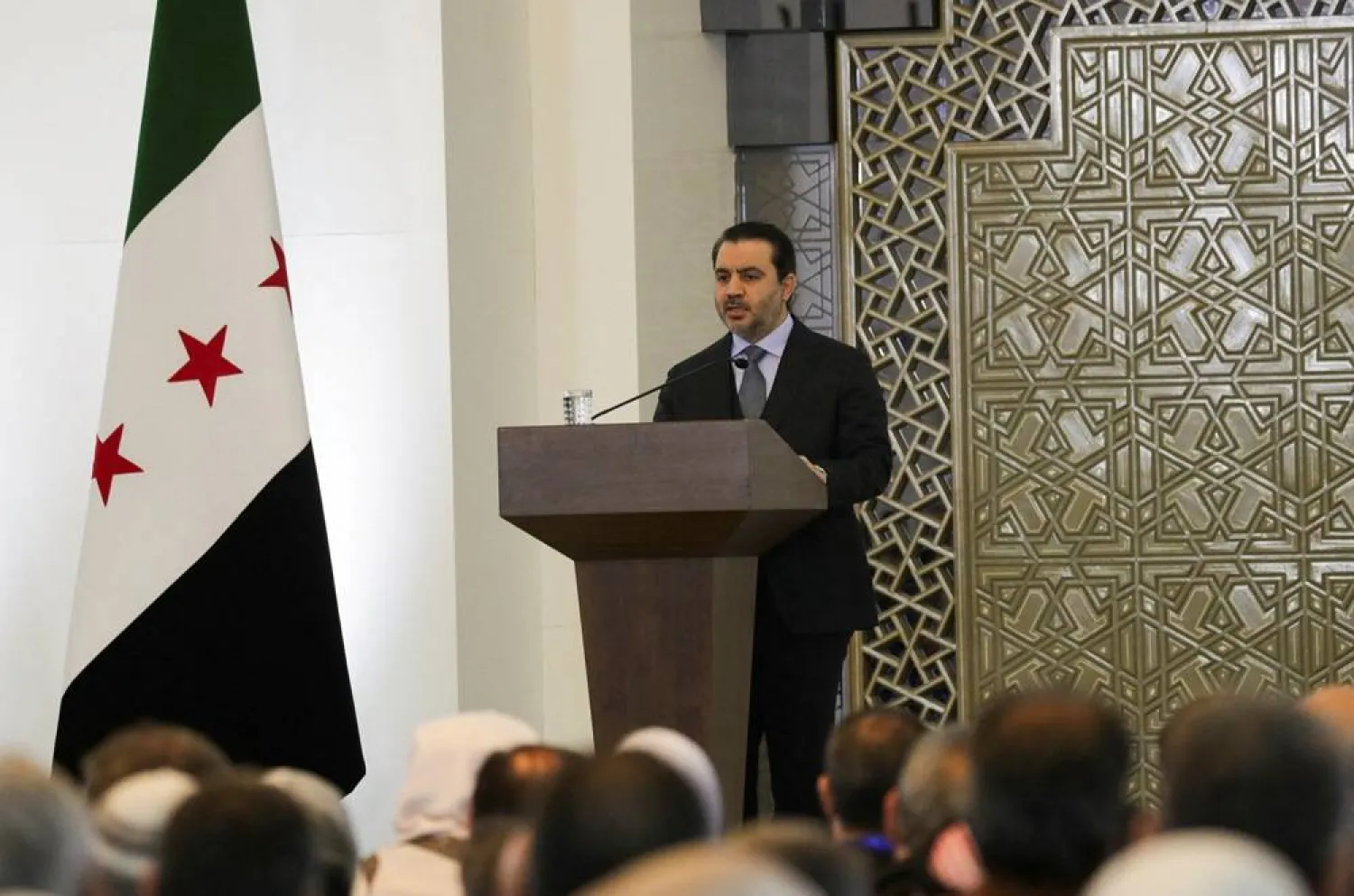 Syrian Foreign Minister Asaad Hassan al-Shibani speaks during a national dialogue, a key milestone in the transition to a new political system after decades of Assad rule, in Damascus, Syria February 25, 2025. (Reuters) 
