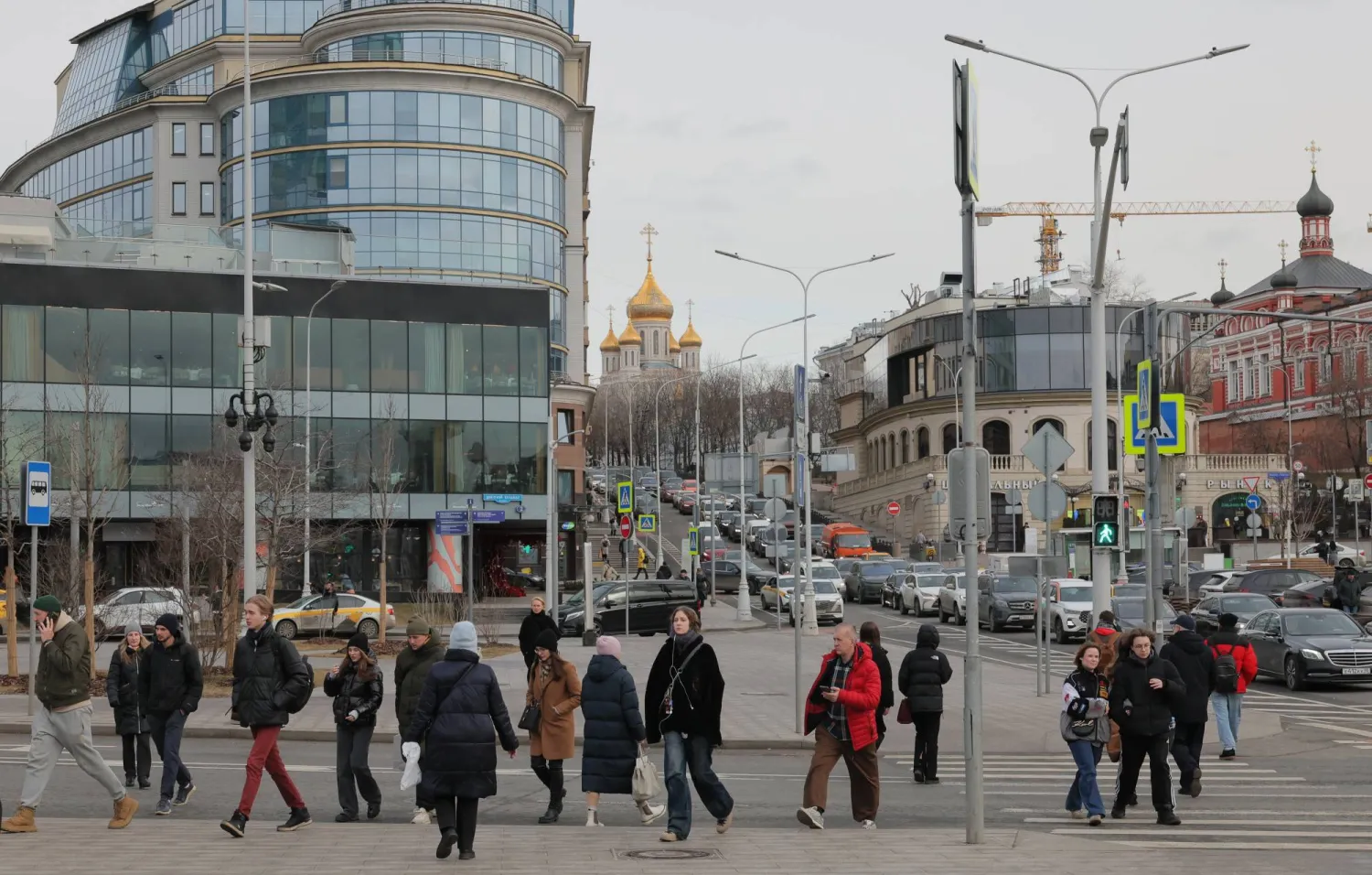 People walk on a street during cloudy weather in downtown Moscow, Russia, 05 March 2025. EPA/MAXIM SHIPENKOV