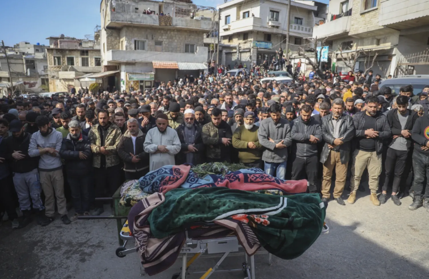 A funeral was held in Syria's Idlib province on Saturday to mourn four security members killed in clashes with loyalists of ousted President Bashar Assad, as a war monitor group said the death toll from two days of clashes and revenge killings had risen to more than 1,000. (AP video shot by Omar Albam)