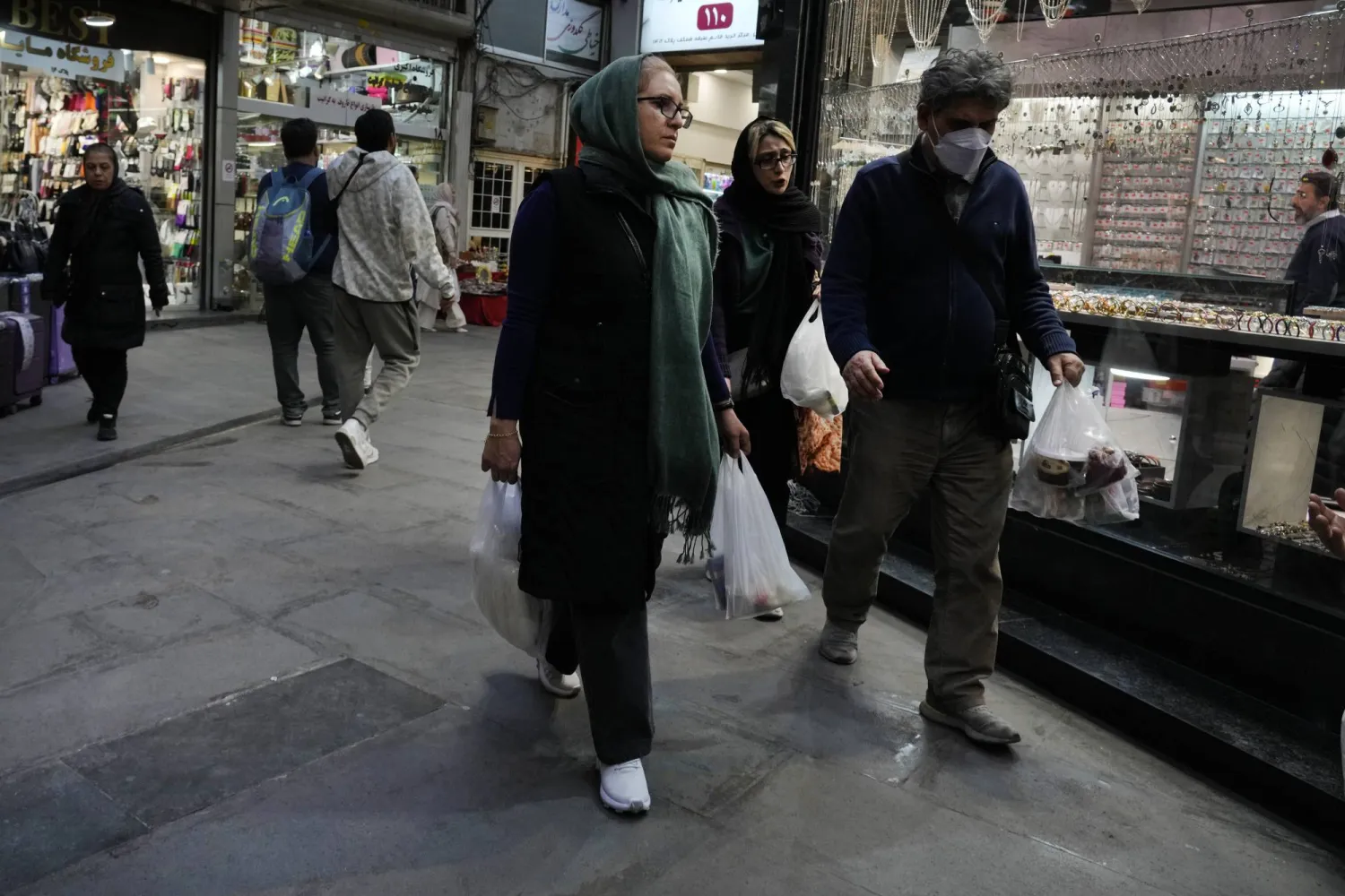 People shop at Tajrish traditional bazaar in northern Tehran, Iran, Saturday, March 15, 2025. (AP Photo/Vahid Salemi)