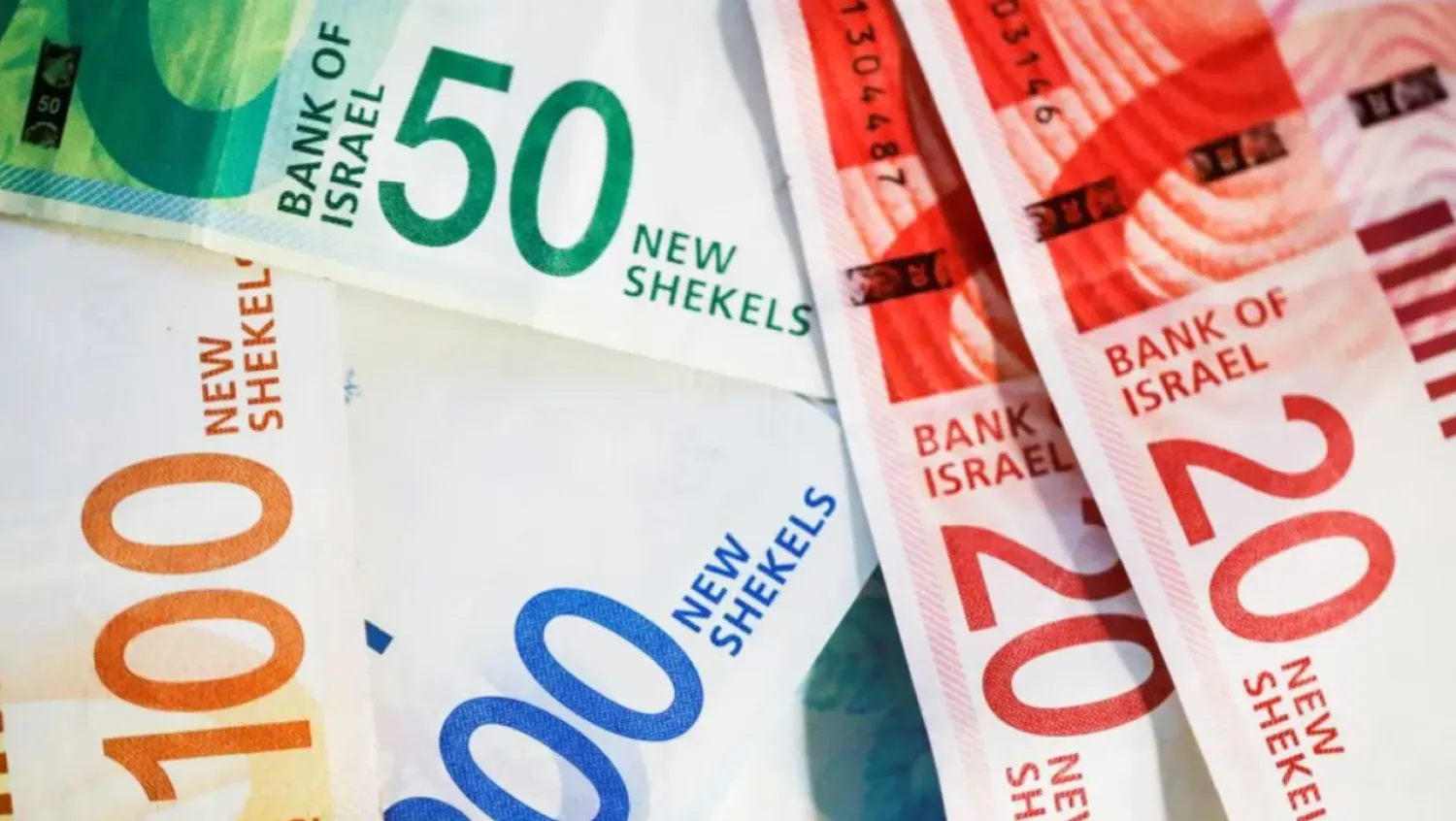 New Israeli Shekel banknotes are seen in this picture illustration taken November 9, 2021. REUTERS/Nir Elias/Illustration/File photo 