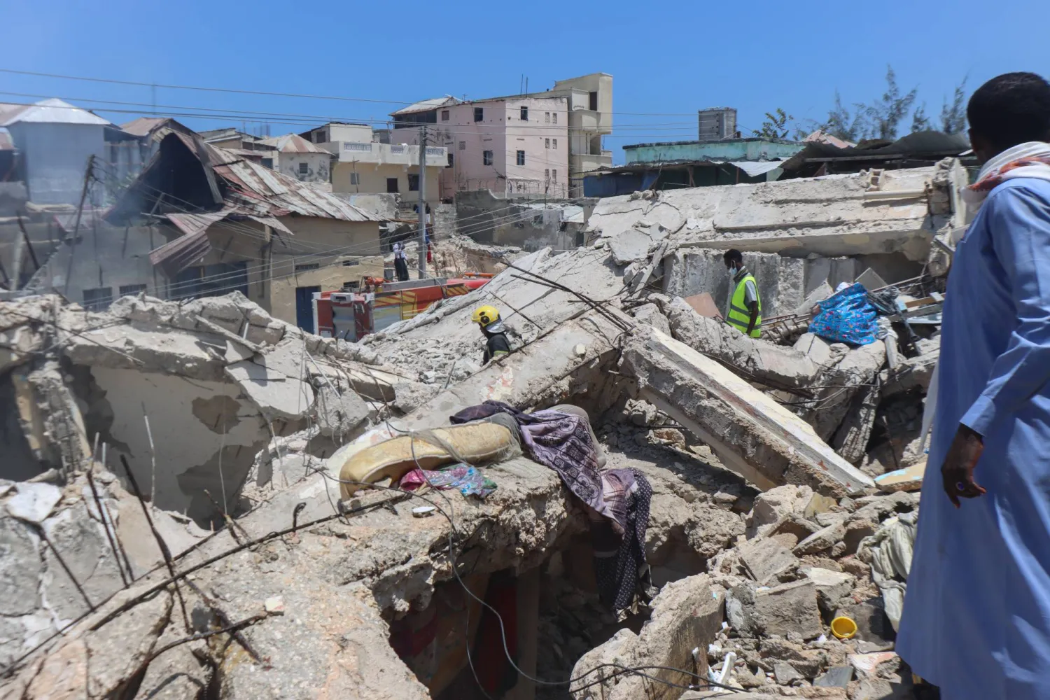 Rescuers look for survivors in the rubble of a residential building after an explosion in Mogadishu, Somalia, 18 March 2025. EPA/SAID YUSUF WARSAME