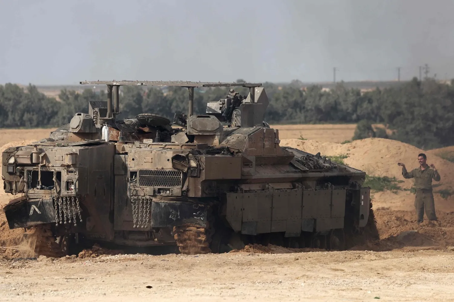 An Israeli army tank parks in a position near Israel's southern border with the Gaza Strip on March 6, 2025. (AFP)