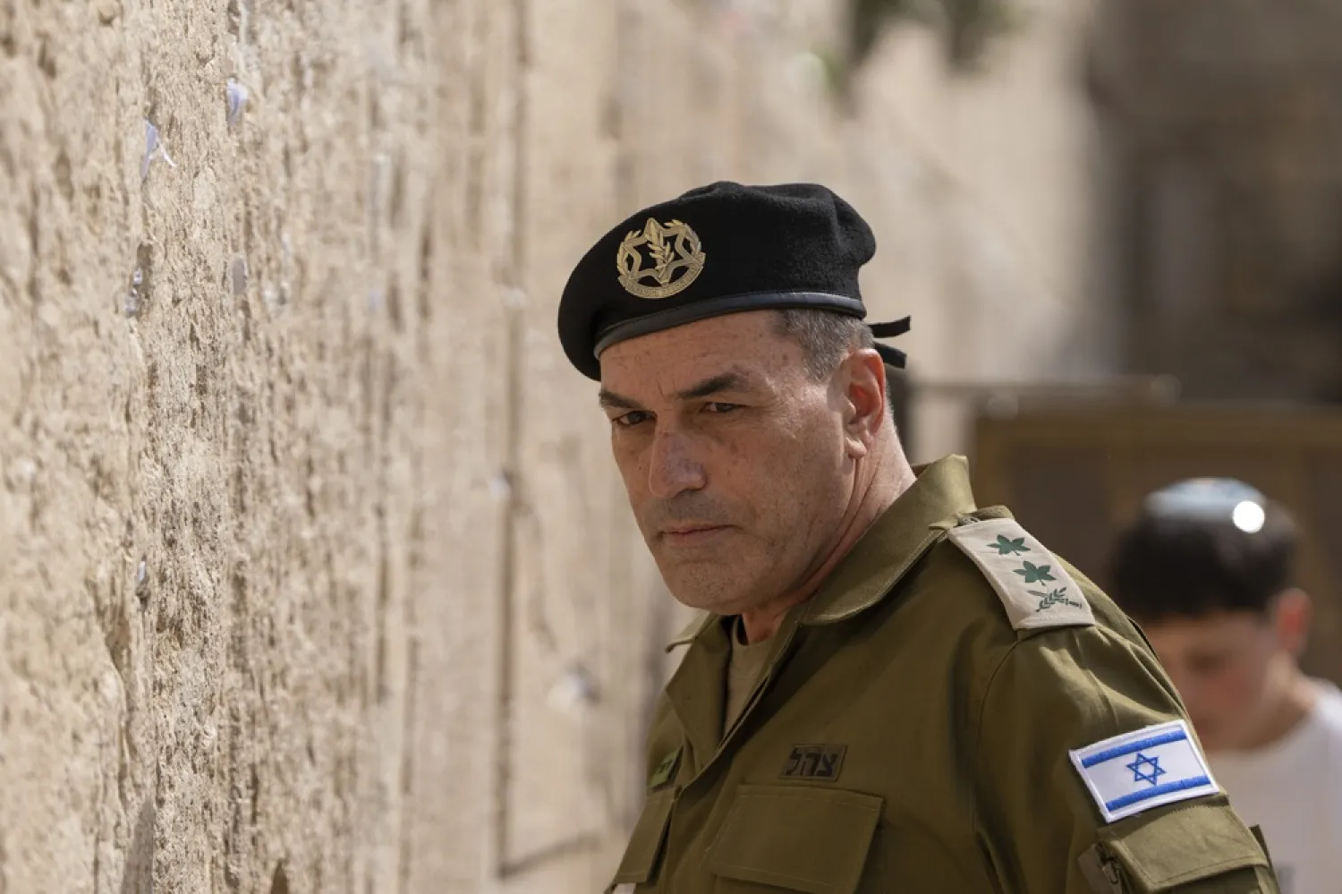 Israel's incoming military chief of staff, Lt. Gen. Eyal Zamir places notes in the Western Wall, the holiest site where Jews can pray, in Jerusalem's Old City on Wednesday, March 5, 2025. (AP) 