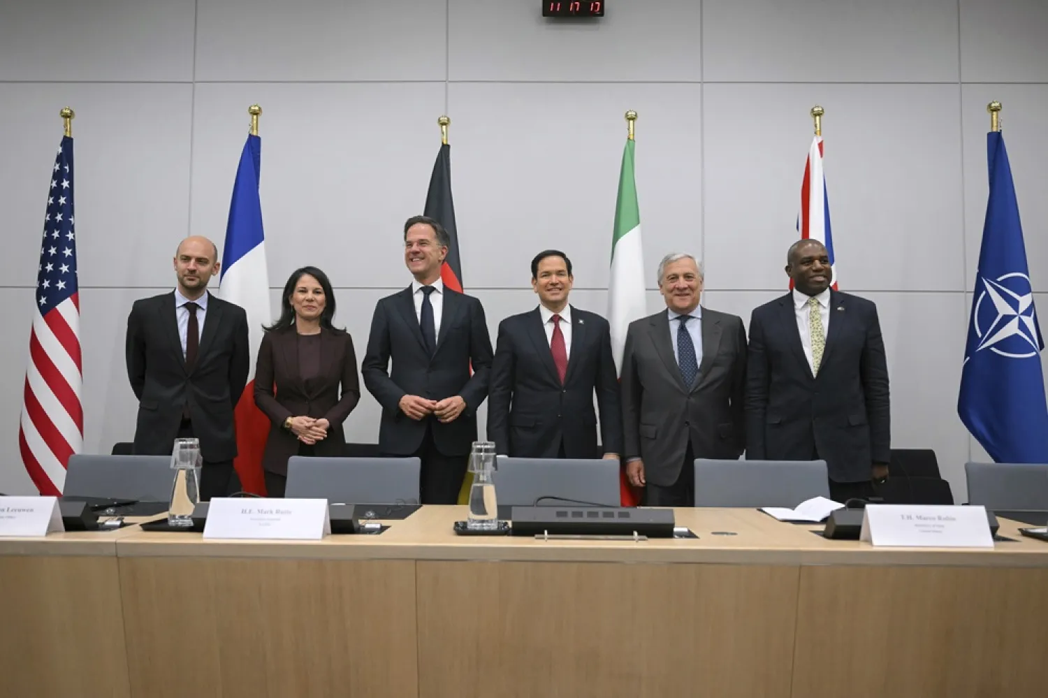 From left, French Foreign Minister Jean-Noel Barrot, Germany's Foreign Minister Annalena Baerbock, NATO Secretary General Mark Rutte, United States Secretary of State Marco Rubio, Italy's Foreign Minister Antonio Tajani and Britain's Foreign Secretary David Lammy pose for a group photo during a meeting on the sidelines of the NATO foreign ministers at NATO headquarters in Brussels, Friday, April 4, 2025. (Nicolas Tucat, Pool Photo via AP) 