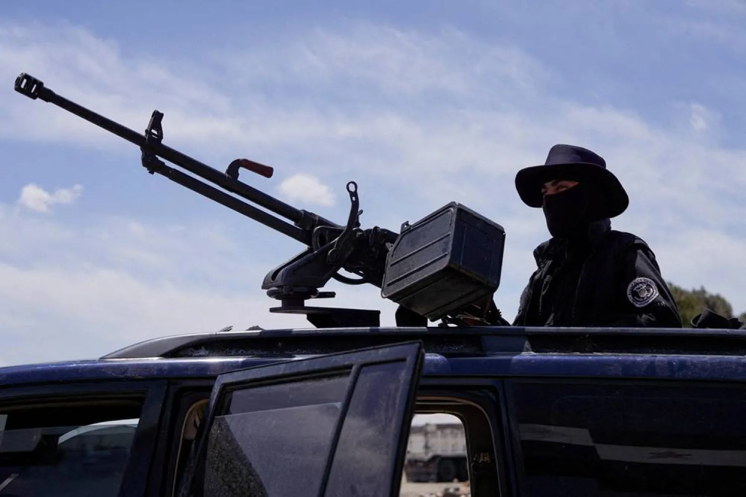 A member of Syrian security forces stands guard after being deployed in the village of Al-Soura al-Kubra, following clashes in the Sweida province, Syria, May 2, 2025. (Reuters) 