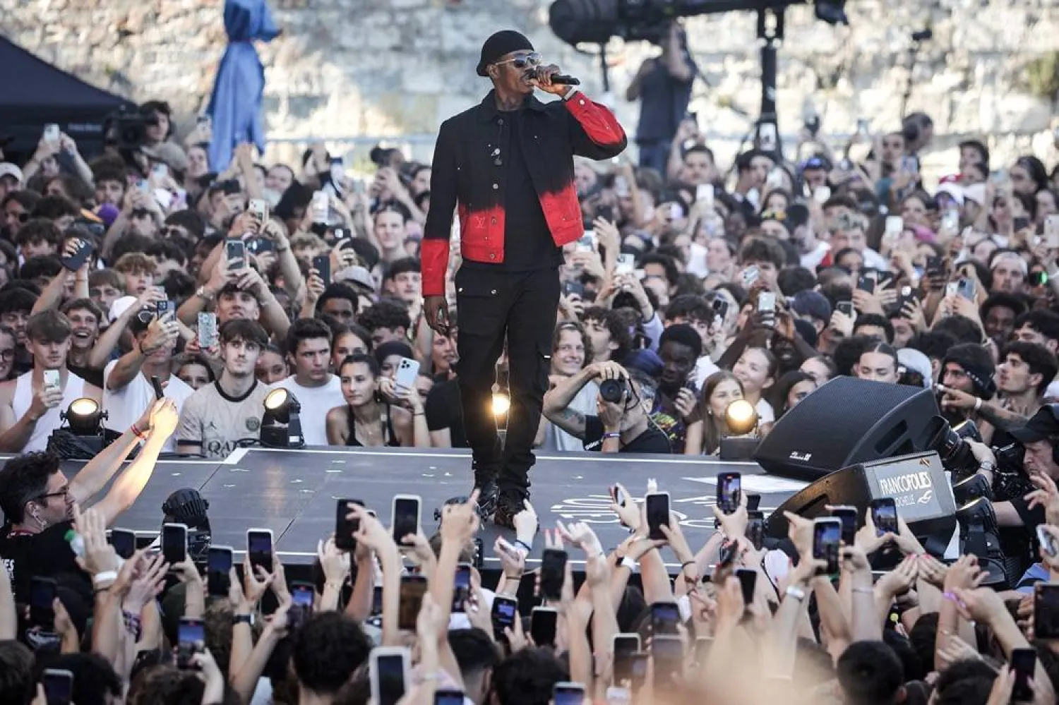 Werenoi performs on stage during the 40th edition of the Francofolies de La Rochelle music festival, in La Rochelle, southwestern France, on July 13, 2024. (AFP)