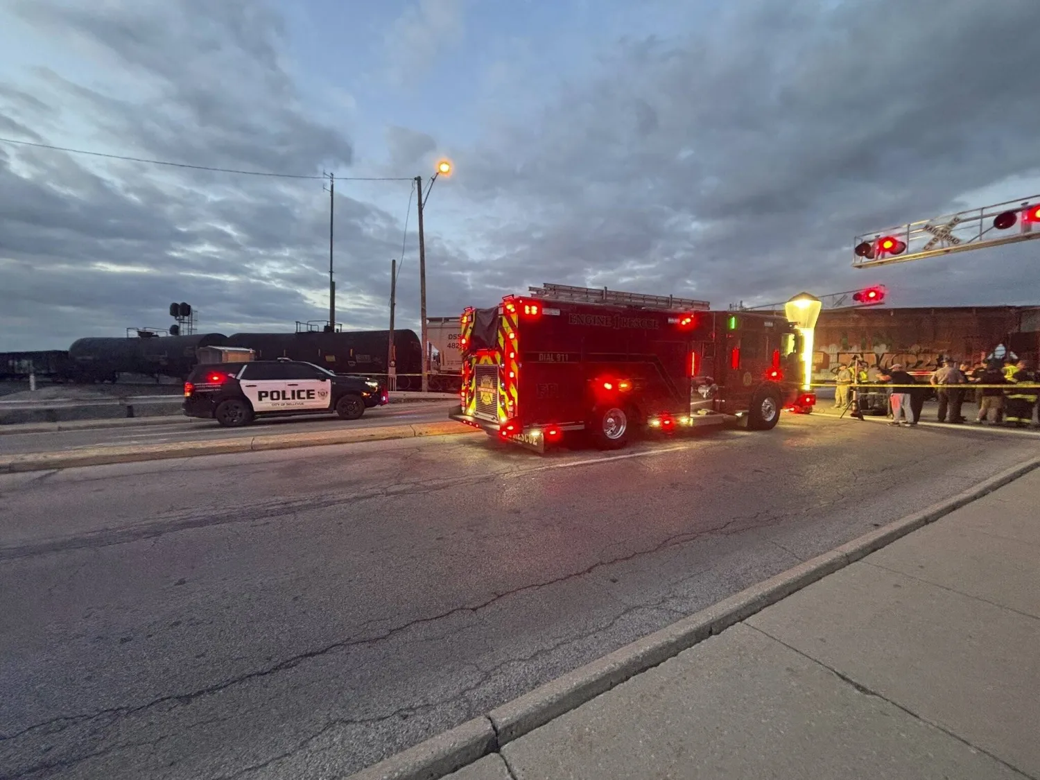 In this photo provided by Emerson Young, first responders are at the scene where a train sits idle on tracks after striking multiple pedestrians Sunday evening, May 18, 2025, in Fremont, Ohio. (Emerson Young via AP)