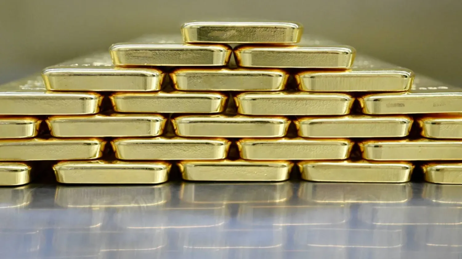 FILE PHOTO: Gold bars are stacked in the safe deposit boxes room of the Pro Aurum gold house in Munich, Germany, January 10, 2025. REUTERS/Angelika Warmuth//File Photo