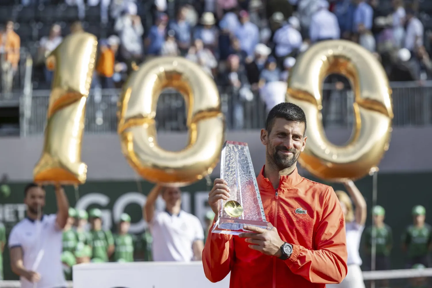Winner Novak Djokovic of Serbia poses with the trophy after the final match of the ATP 250 Geneva Open tennis against Hubert Hurkacz of Poland, in Geneva, Switzerland, Saturday, May 24, 2025. (Martial Trezzini/Keystone via AP)