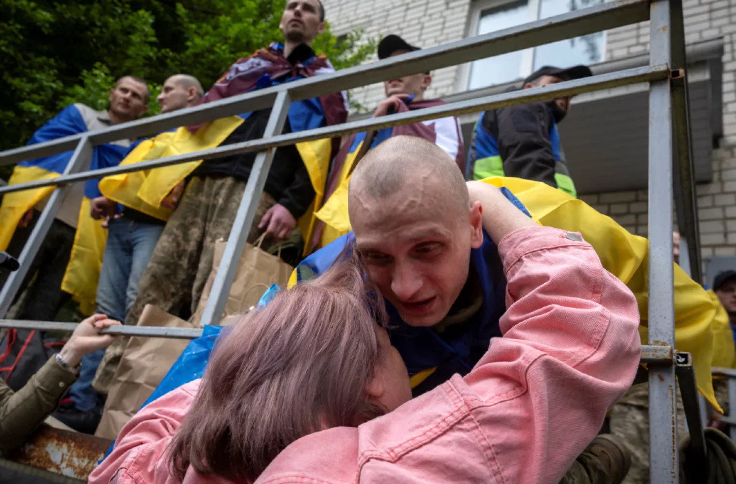 File: A former Ukrainian prisoners of war (POW) comforts a relative whose loved one is still missing after a prisoner swap with Russia, amid Russia's attack on Ukraine, in an undisclosed location in Ukraine, May 6, 2025. REUTERS/Thomas Peter