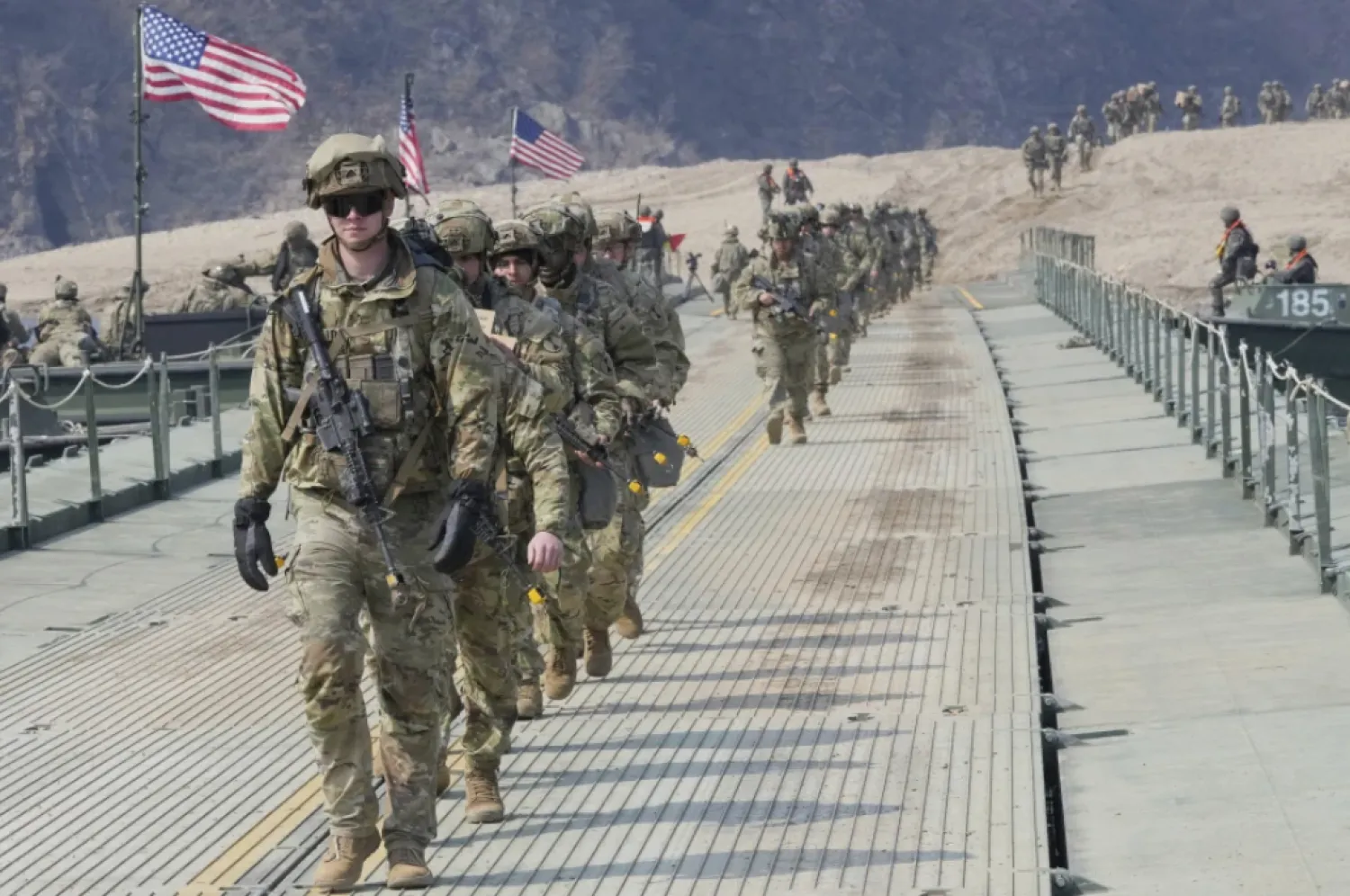 US Army soldiers cross a floating bridge on the Imjin River during a joint river-crossing exercise between South Korea and the United States as a part of the Freedom Shield military exercise in Yeoncheon, South Korea, March 20, 2025. (AP Photo/Ahn Young-joon, File)


