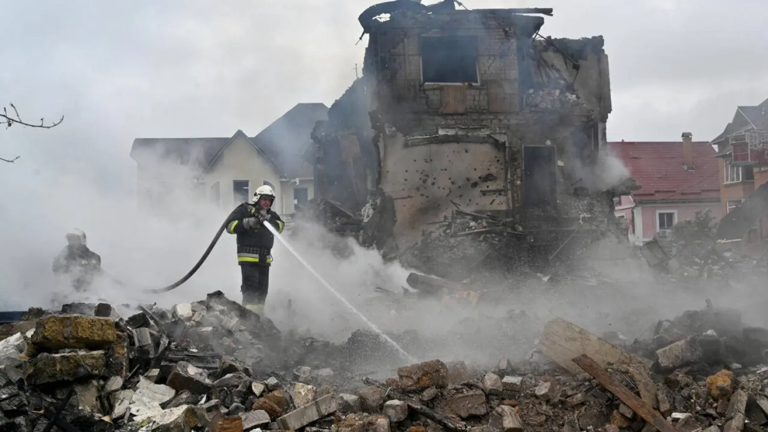 Firefighters extinguish a blaze following Russian strike in the Kyiv region. Sergei SUPINSKY / AFP
