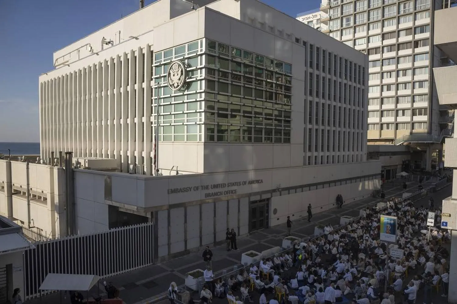 Activists sit in front of the US Embassy branch office in Tel Aviv, Israel, during a protest, Wednesday, Jan. 8, 2025. (AP)