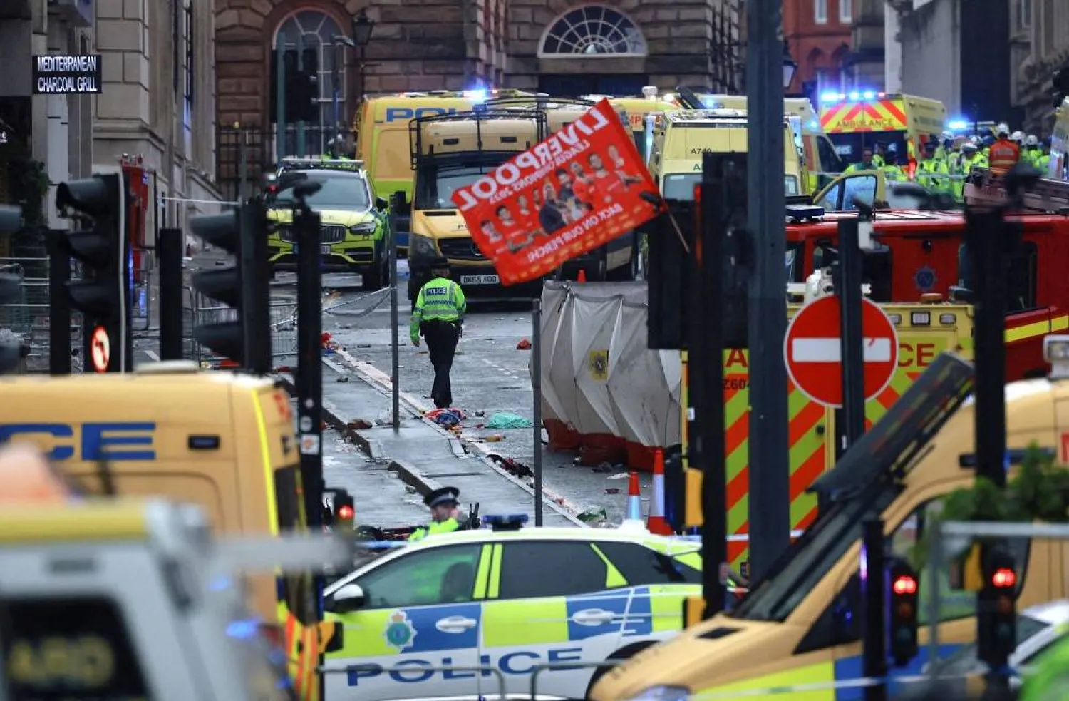 Football - Premier League - Liverpool Victory Parade - Liverpool, Britain - May 26, 2025 Emergency services at the scene after multiple people were hit by a car during the victory parade. (Reuters) 