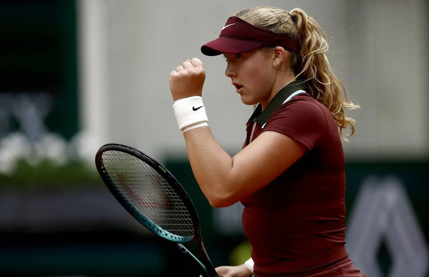 Mirra Andreeva of Russia pumps fist during her Women's 1st round match against Cristina Bucsa of Spain at the French Open Grand Slam tennis tournament at Roland Garros in Paris, France, 27 May 2025. (EPA) 