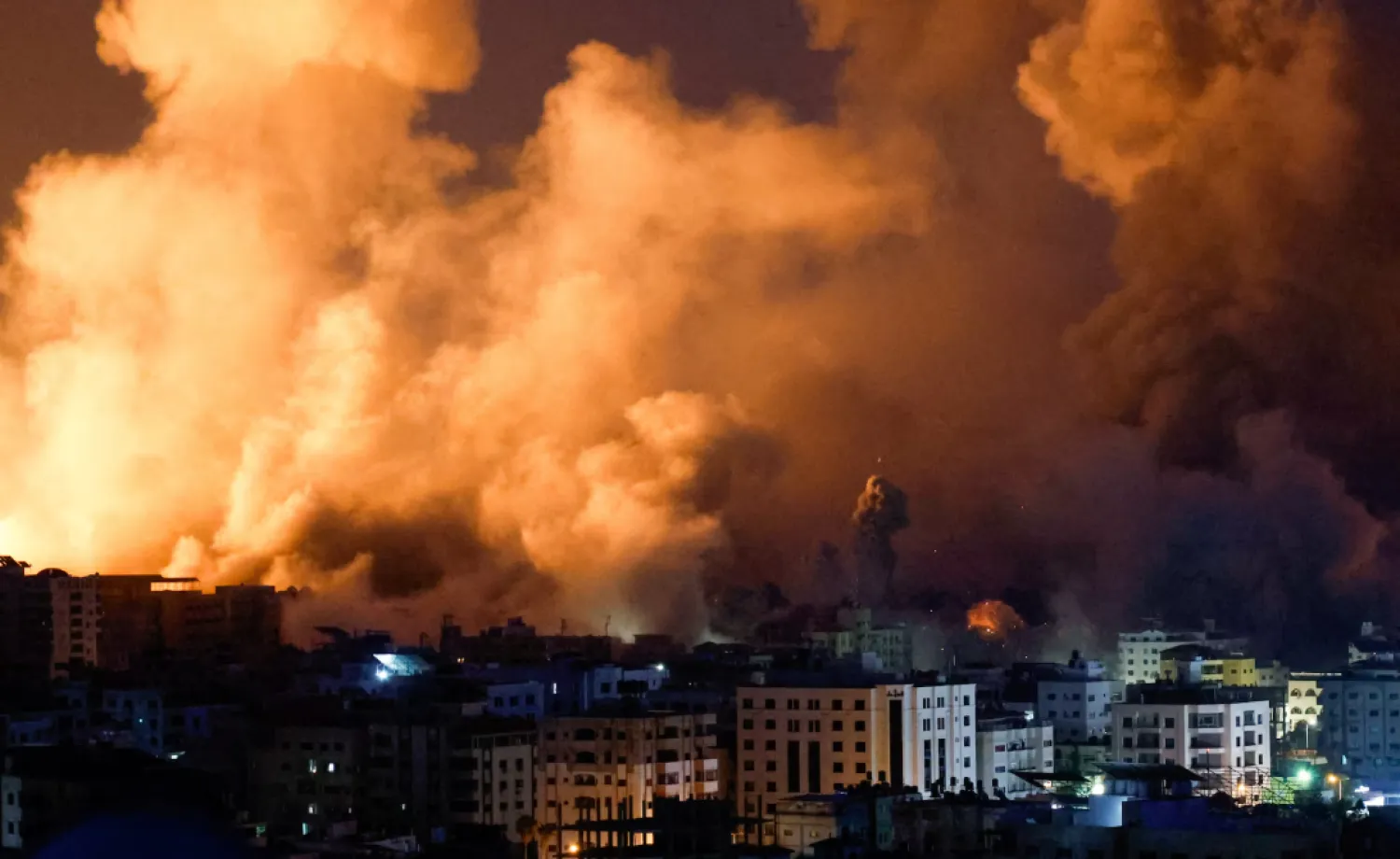 Flames and smoke billow during Israeli strikes in Gaza, October 9. REUTERS/Mohammed Salem
