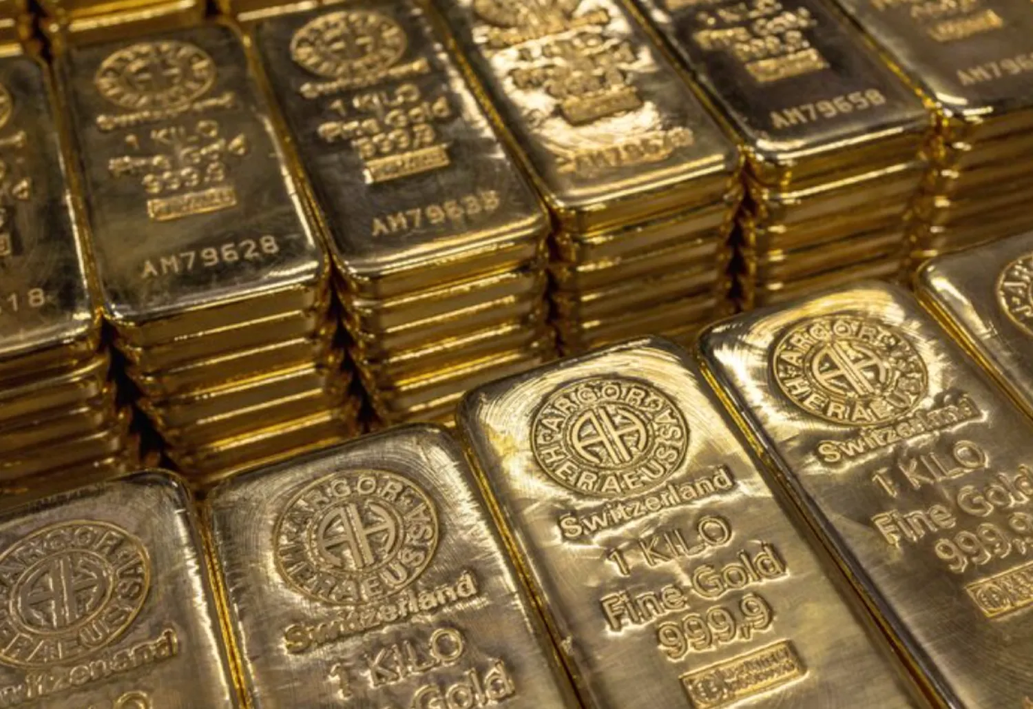 One kilo gold bars are pictured at the plant of gold and silver refiner and bar manufacturer Argor-Heraeus in Mendrisio, Switzerland, July 13, 2022. REUTERS/Denis Balibouse/File Photo 