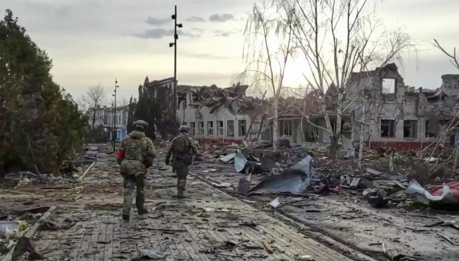 In this photo taken from video distributed by the Russian Defense Ministry Press Service on Thursday, March 13, 2025, Russian soldiers patrol an area in Sudzha, in the Kursk region of Russia, after it was taken over by Russian troops. (Russian Defense Ministry Press Service via AP) 
