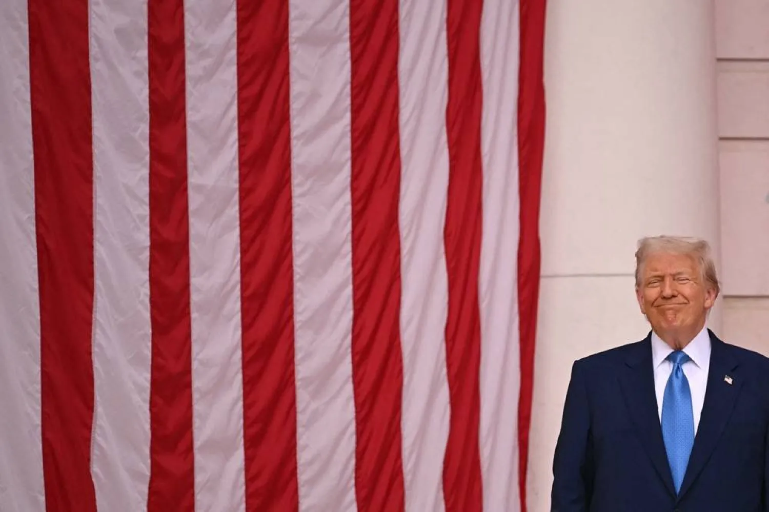 US President Donald Trump smiles before speaking in the amphitheater at the Tomb of the Unknown Soldier in Arlington National Cemetery in Arlington, Virginia, on Memorial Day, May 26, 2025. (AFP) 