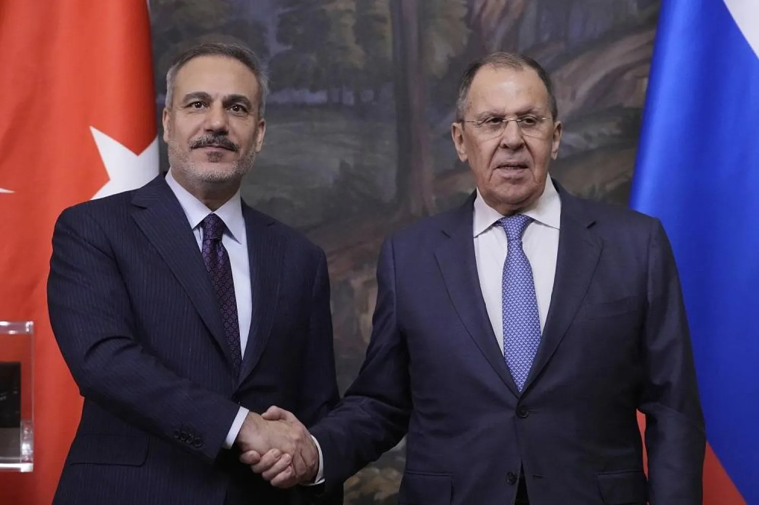 Russian Foreign Minister Sergei Lavrov, right, and Turkish Foreign Minister Hakan Fidan shake hands during their meeting in Moscow, Russia, Tuesday, May 27, 2025. (AP) 