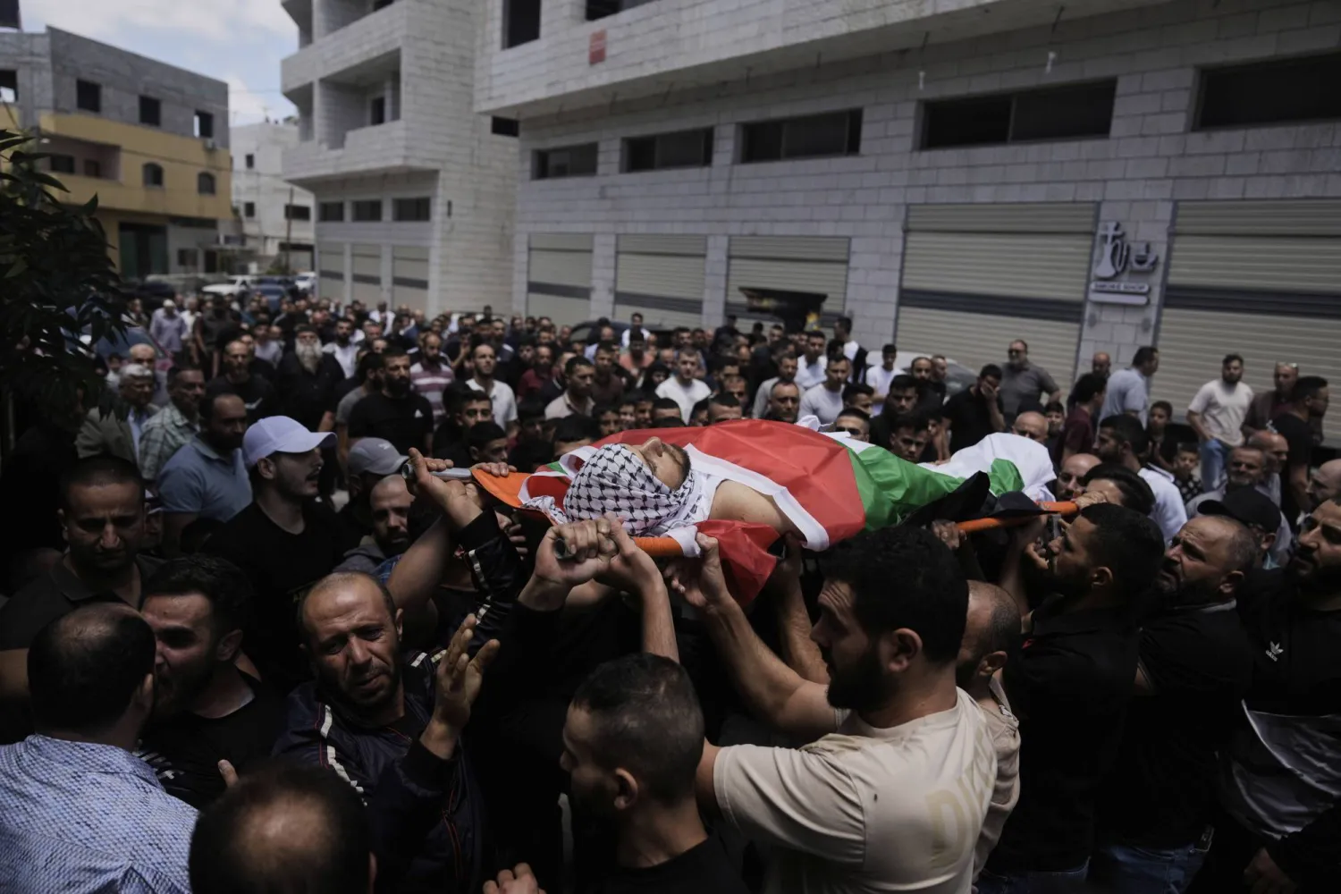 من جنازة جاسم السدة (أ.ب)