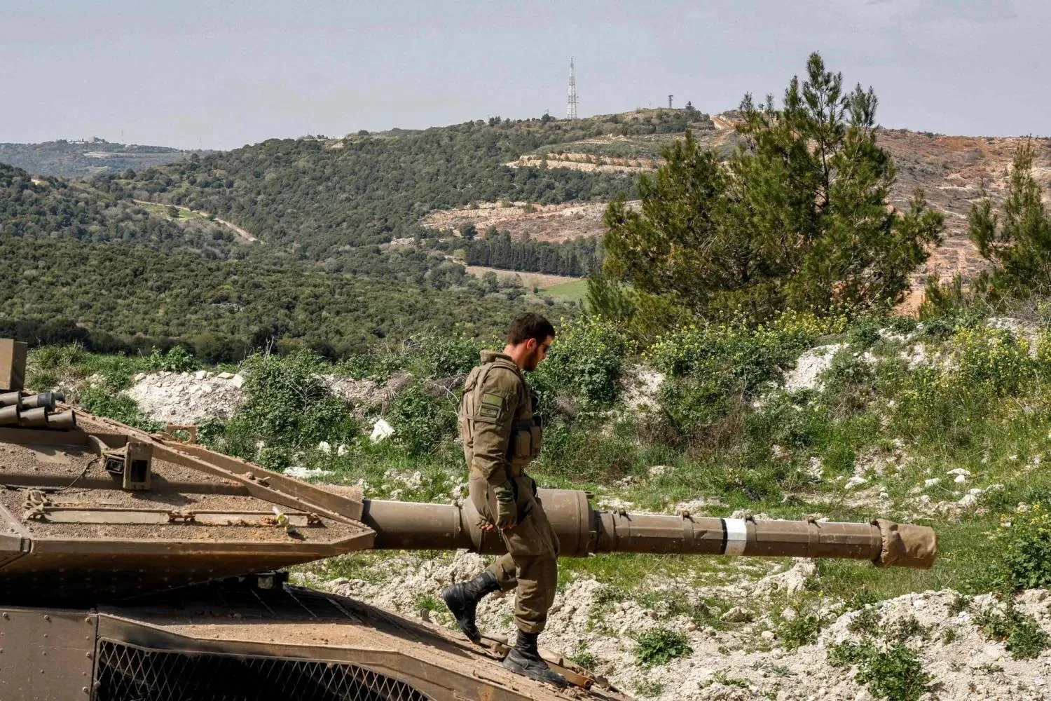 An Israeli soldier is seen at a position in northern Israel near the border with Lebanon on March 18, 2025. (AFP) 