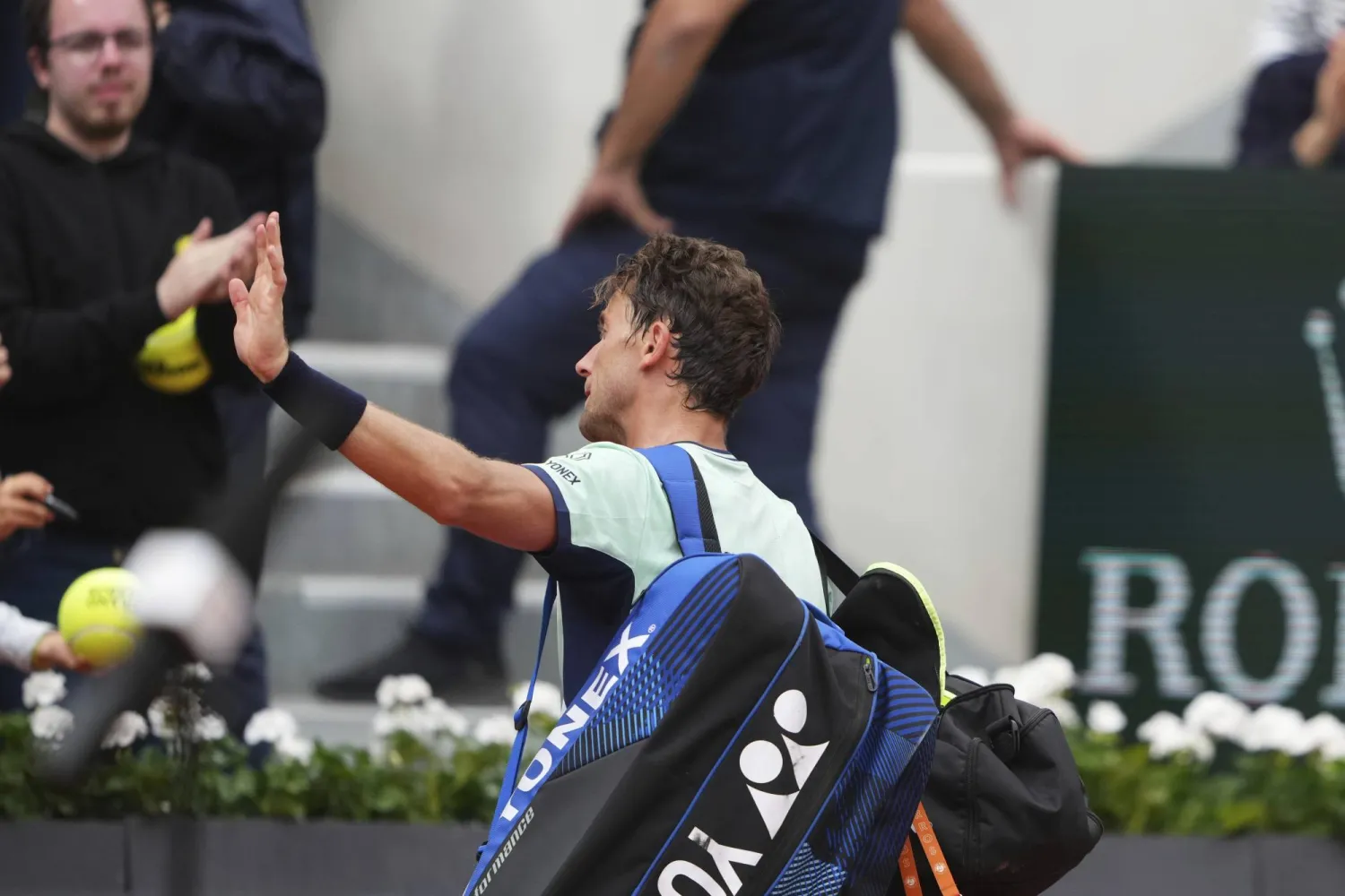 Norway's Casper Ruud greets fans after loosing to Portugal's Nuno Borges after their second round match of the French Tennis Open, at the Roland-Garros stadium, in Paris, Wednesday, May 28, 2025. (AP Photo/Lindsey Wasson)