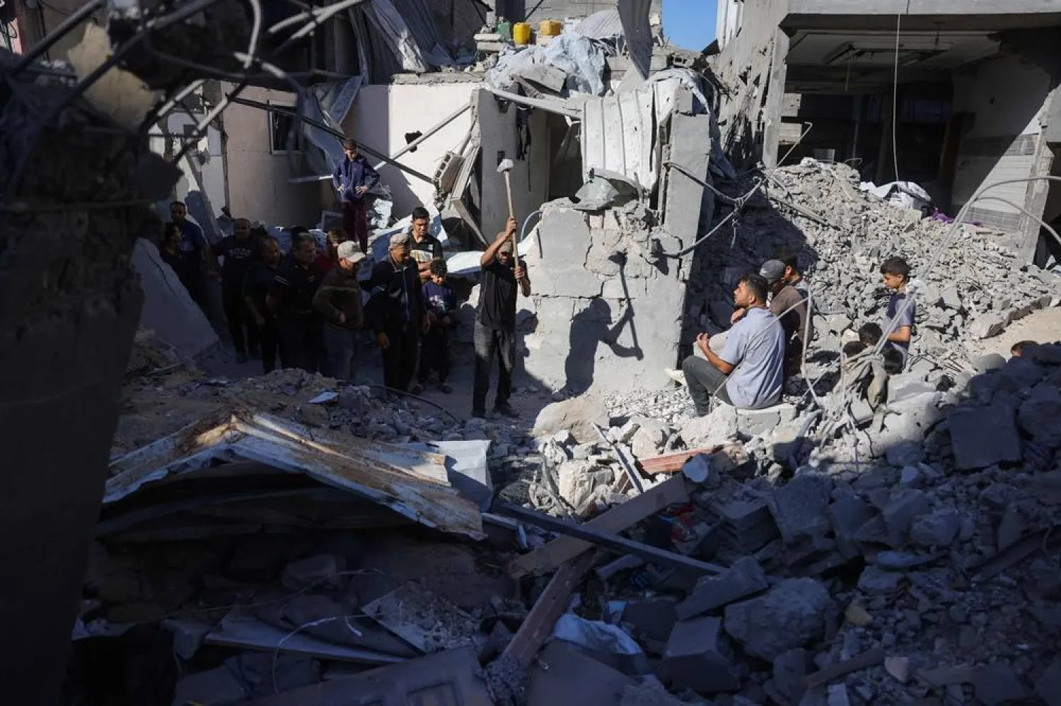 Palestinians clear the rubble of the Azzam family home which was hit in Israeli strikes on central Jabaliya in the northern Gaza Strip on May 29, 2025. (AFP) 