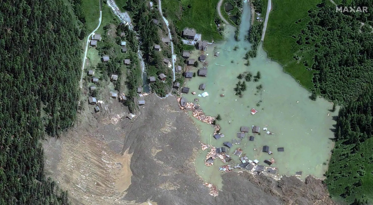 This handout satellite image courtesy of Maxar Technologies created on May 29, 2025, shows the small village of Blatten and its surroundings in the Bietschhorn mountain of the Swiss Alps, Switzerland on May 29, 2025 after it was destroyed the previous day by a landslide. (Photo by Handout / Satellite image 2025 Maxar Technologies / AFP)