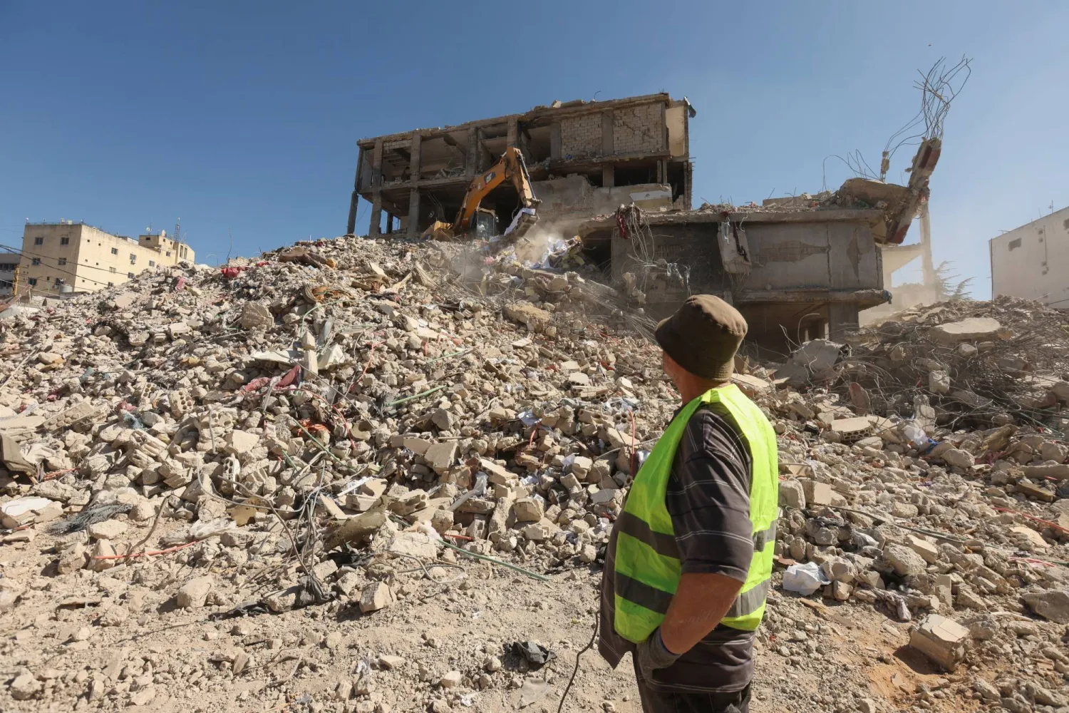 A machine clears rubble at a damaged site in Nabatieh, southern Lebanon May 19, 2025. REUTERS/Aziz Taher