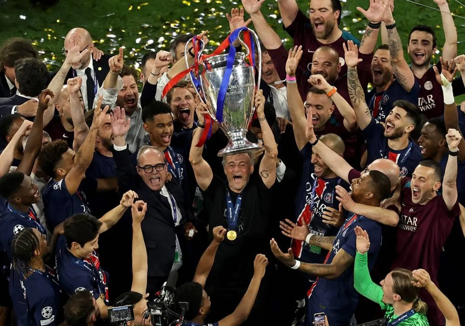 PSG head coach Luis Enrique lifts the trophy after the team won the UEFA Champions League final between Paris Saint-Germain and Internazionale Milano in Munich, Germany 31 May 2025. (EPA)