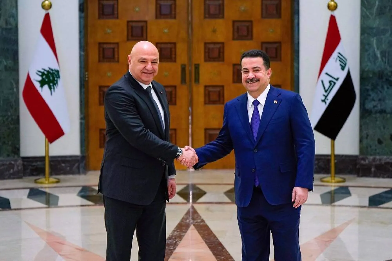 This handout pictured released the Iraq's Prime Minister's Media Office shows Prime Minister Mohammed Shia al-Sudani (R) meeting Lebanese President Joseph Aoun at the government palace in the Green Zone in Baghdad, on June 1, 2025. (Iraqi Prime Minister’s Press Office / Handout / AFP)  