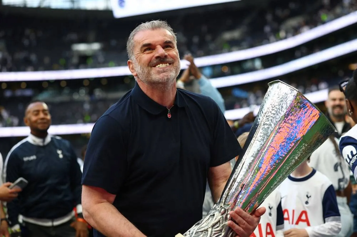 Football - Premier League - Tottenham Hotspur v Brighton & Hove Albion - Tottenham Hotspur Stadium, London, Britain - May 25, 2025 Tottenham Hotspur manager Ange Postecoglou with the Europa League trophy during a lap of appreciation after the match. (Action Images via Reuters)