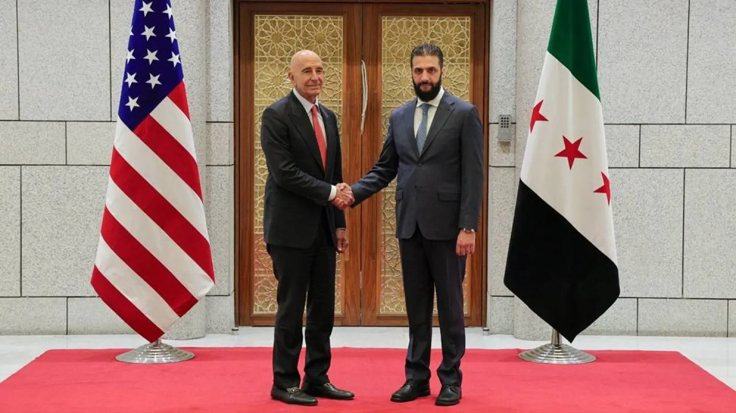 29 May 2025, Syria, Damascus: Syrian President Ahmed al-Sharaa receives US Special Envoy to Syria, Thomas Barrack, at the People's Palace in Damascus. (SANA) 