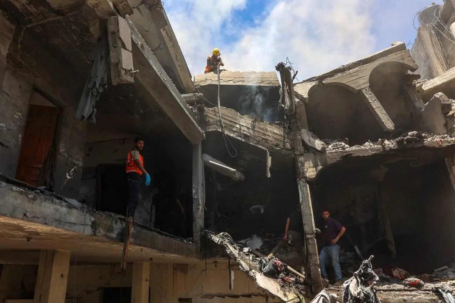  People look for survivors following an Israeli strike that targeted the home of the Al-Bursh family in Jabalia in the northern Gaza Strip on June 2, 2025. (AFP) 