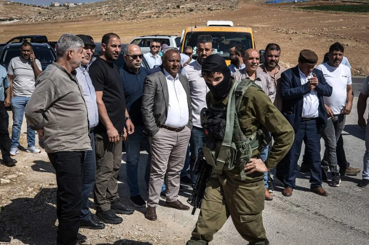 Israeli security forces block a Palestinian Authority delegation from entering the village of al-Tuwani in the Masafer Yatta area in Occupied West Bank on June 2, 2025. (AFP) 