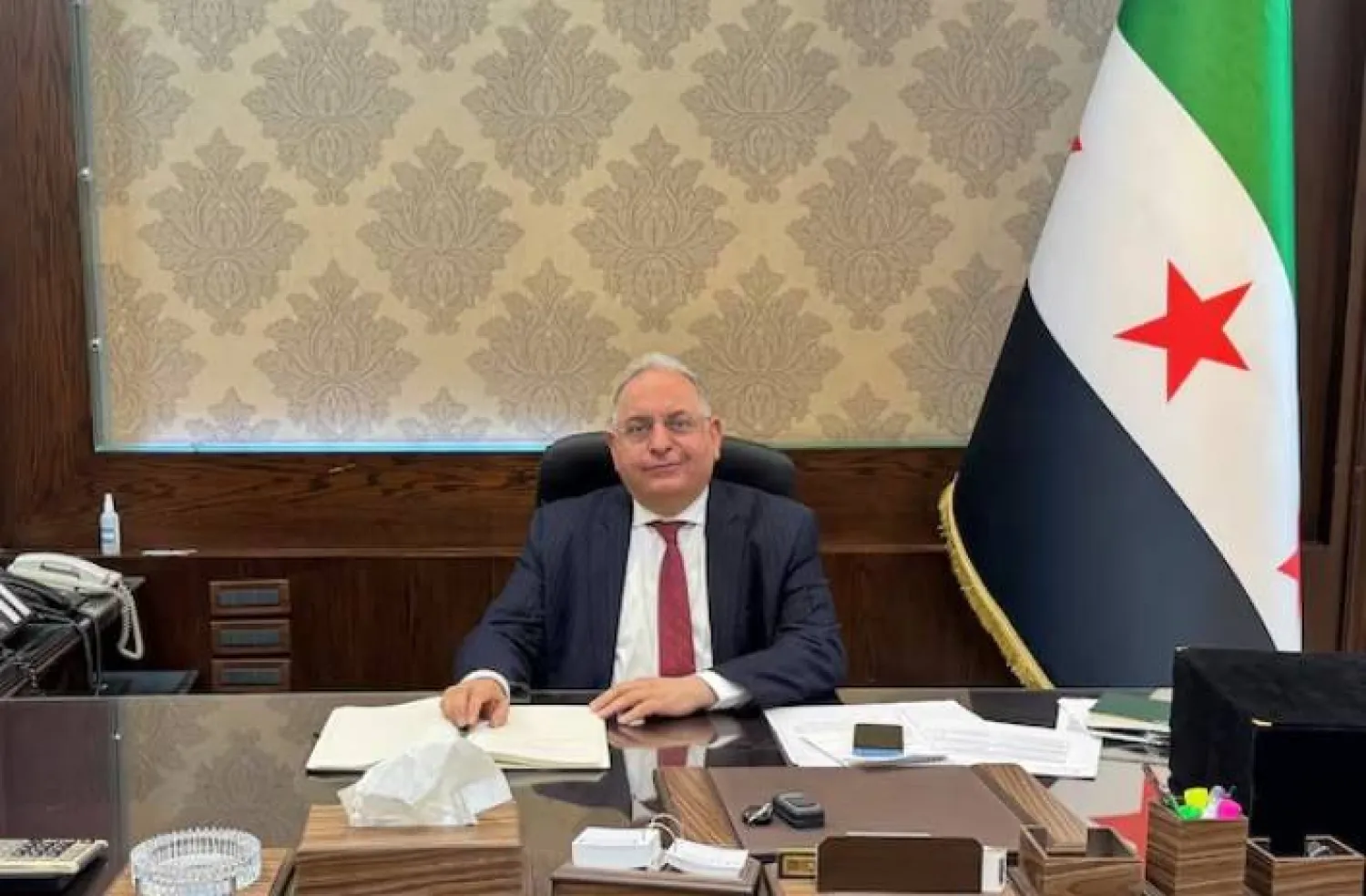 محمد يسر برنية خلال مقابلة مع «رويترز» بوزارة المالية في دمشق (رويترز)