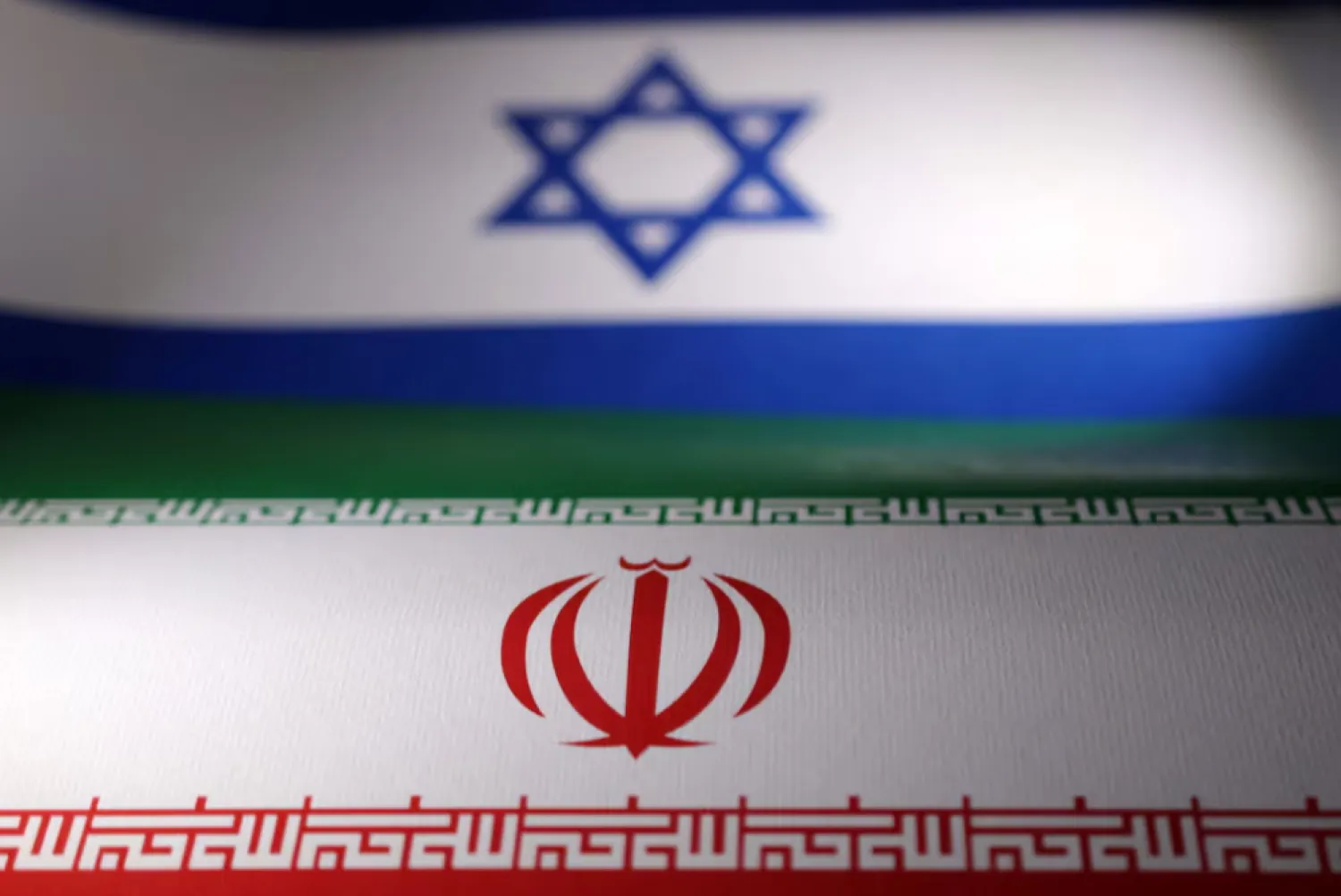 Israeli and Iranian flags are seen in this illustration taken, April 24, 2024. REUTERS/Dado Ruvic/Illustration 