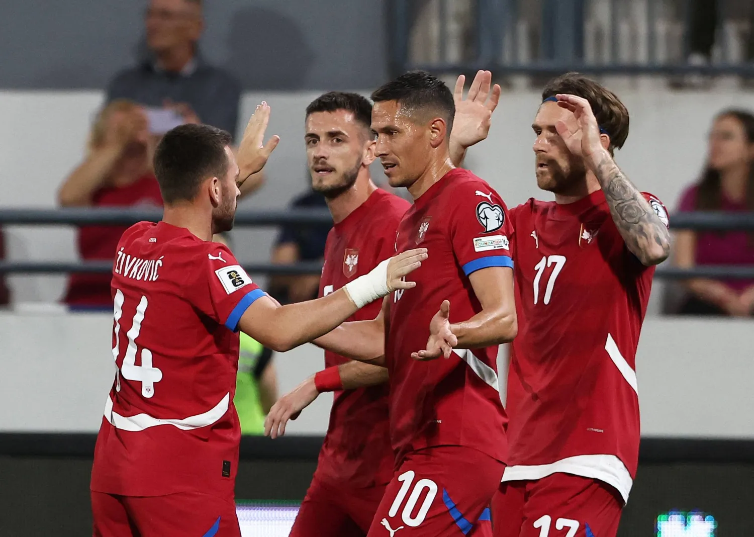 احتفال لاعبي صربيا بالفوز الكبير على أندورا (رويترز)