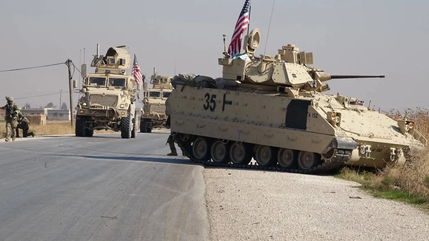 US Bradley armored vehicles on patrol along the main road connecting Qamishli in the east to Tel Tamr in the west, in Syria’s Hasakah province.