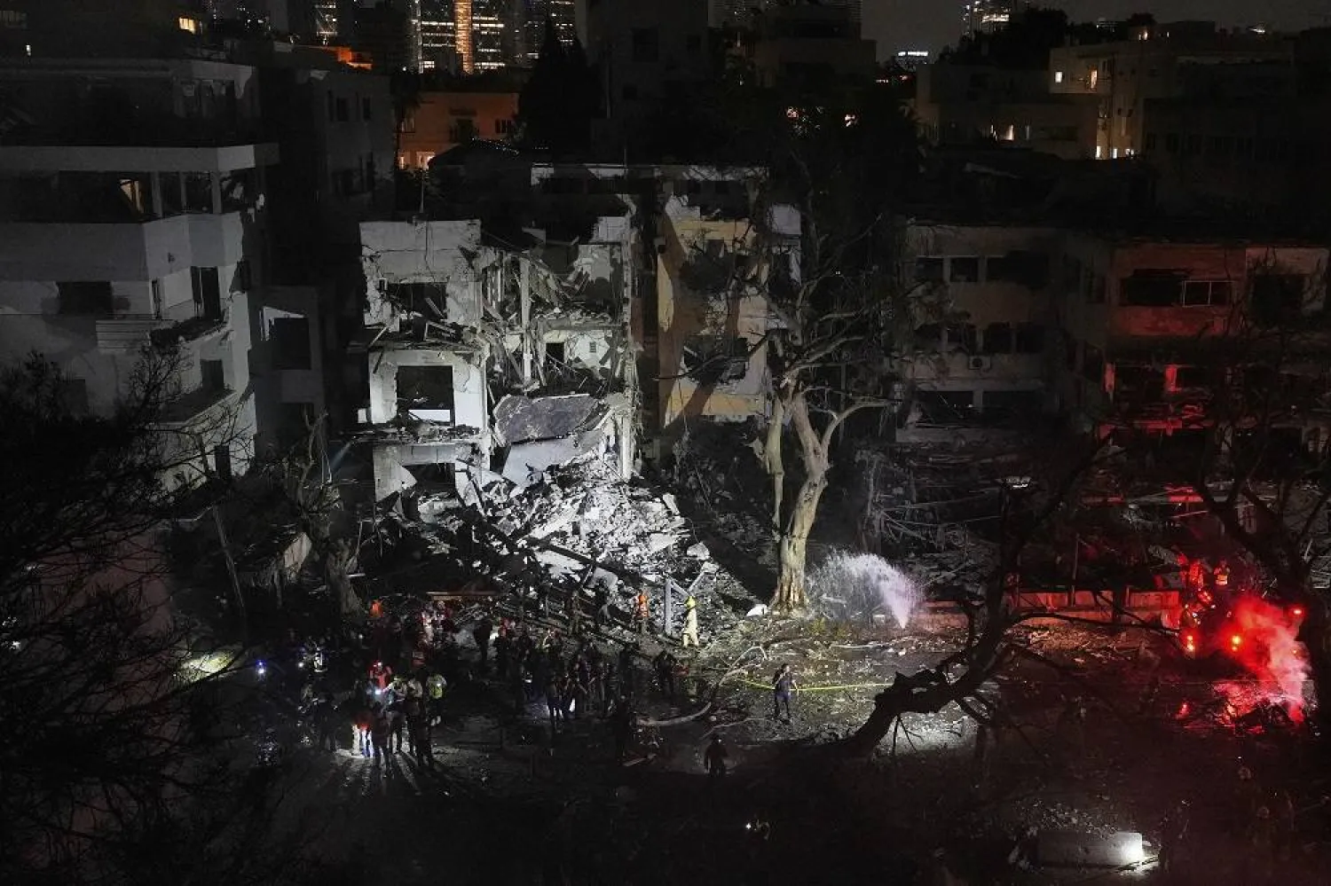 Rescue team work at the site where a missile launched from Iran struck Tel Aviv, Israel, Monday, June 16, 2025. (AP)