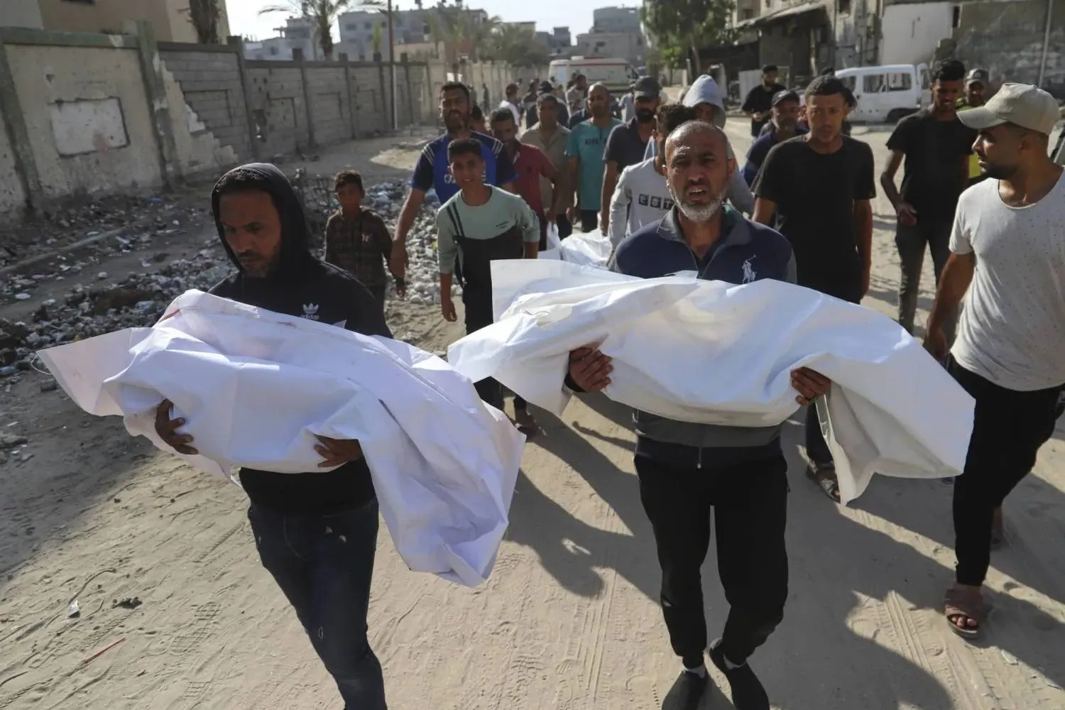 Palestinians carry bodies of relatives killed in Israeli strike in Khan Younis on Tuesday. (AP) 