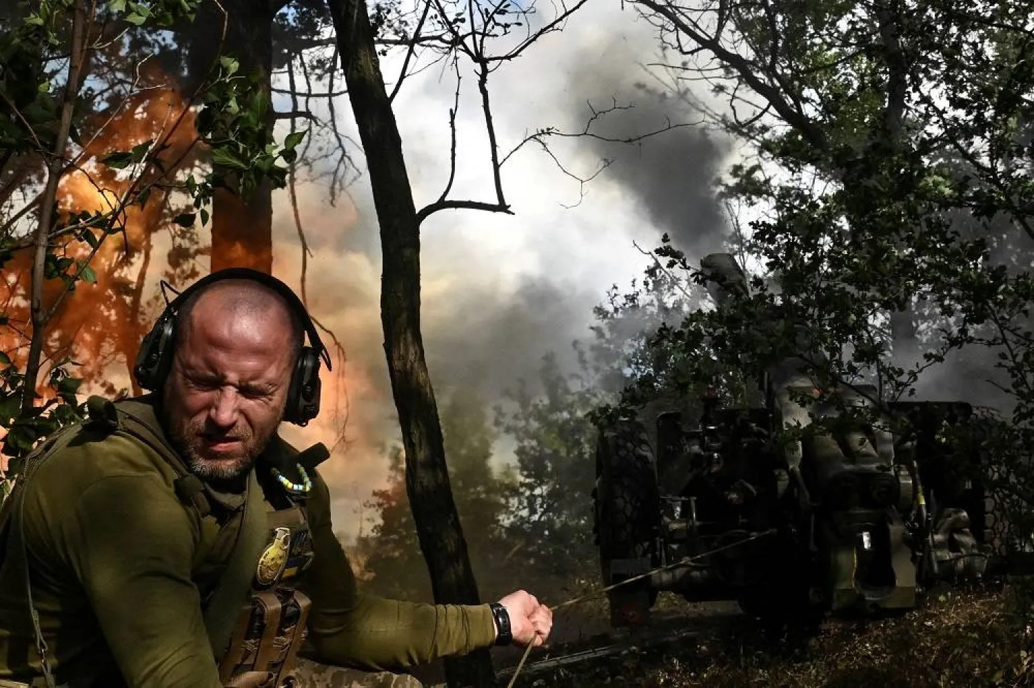 A service member of the 110th Separate Brigade of the Territorial Defense Forces of the Ukrainian Armed Forces fires a howitzer towards Russian troops, amid Russia's attack on Ukraine, at a front line in Zaporizhzhia region, Ukraine June 16, 2025. (Reuters)
