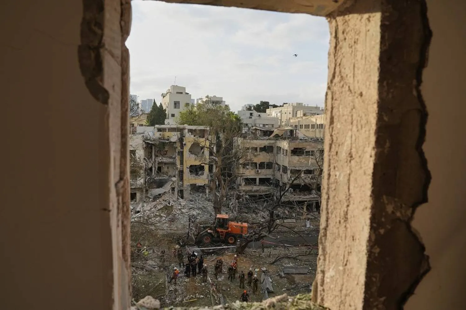 Rescue team work at the site where a missile launched from Iran struck Tel Aviv, Israel, Monday, June 16, 2025. (AP)