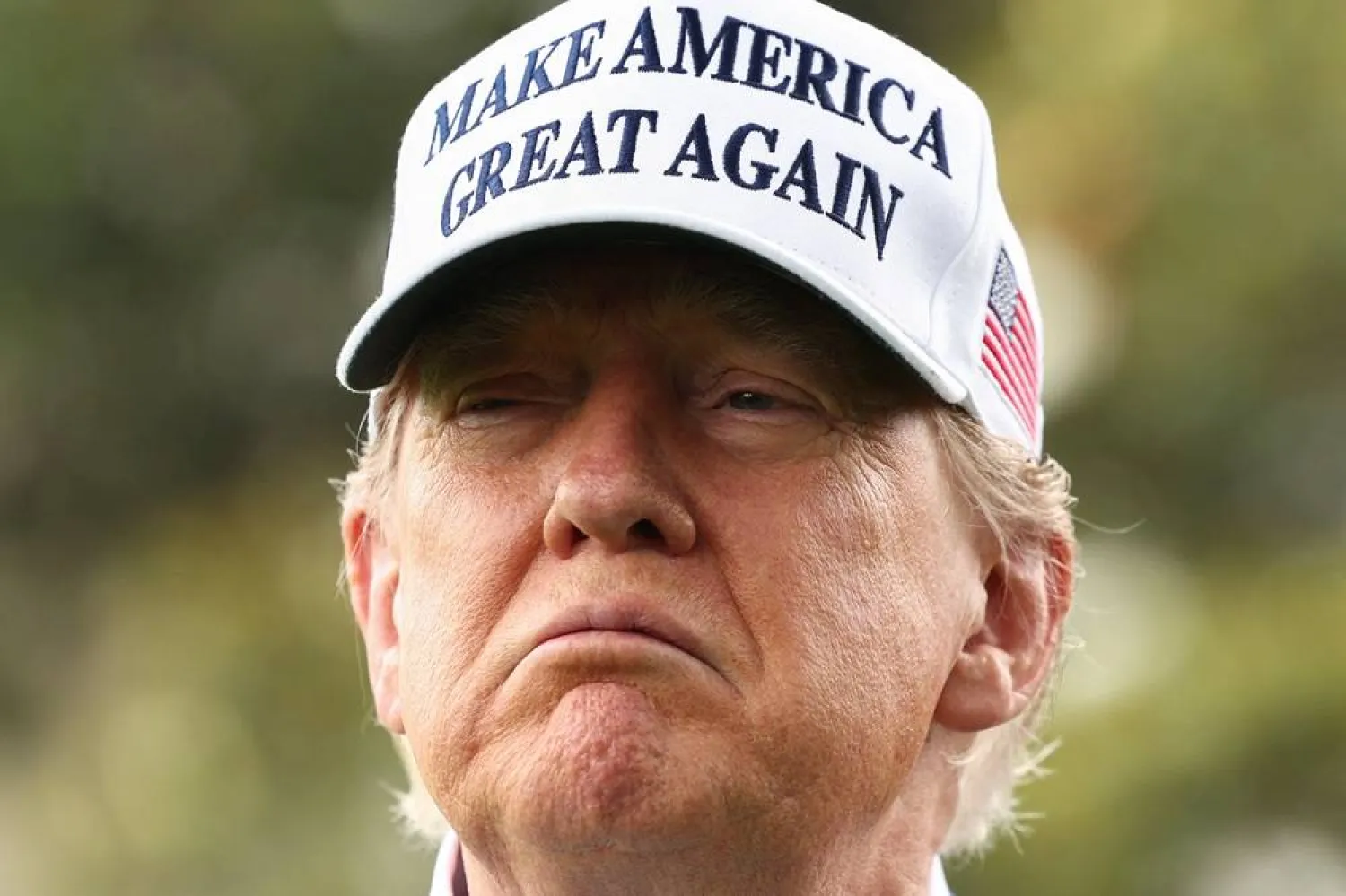 US President Donald Trump looks on during the installation of a new flagpole on the South Lawn at the White House in Washington, DC, US, June 18, 2025. (Reuters)